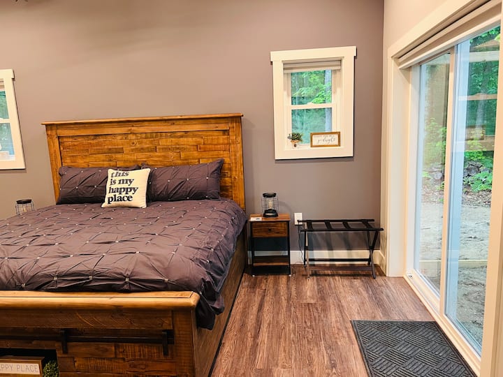Master bedroom which also has a sliding glass door onto the porch.