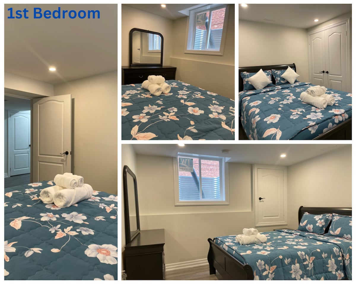 A bright private bedroom is showcased with a spacious bed featuring a floral-patterned quilt. Adjacent amenities include a dresser and nightstand. A large window provides natural light, while a mirror reflects the room's design. A door leads to the shared washroom.