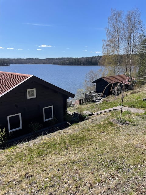 Two holiday homes on a lake plot with eight beds