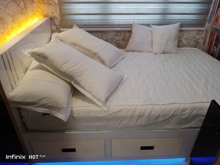 Incorporated supplementary bed drawers equipped with strip lights and blackout blinds on the windows.