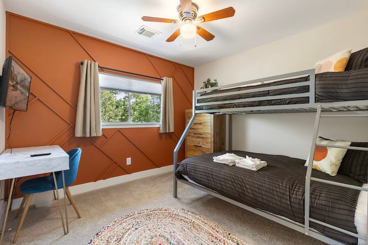 This bunkroom with a full plus twin bed also has a desk with TV so your kids or yourself can study or work from home.