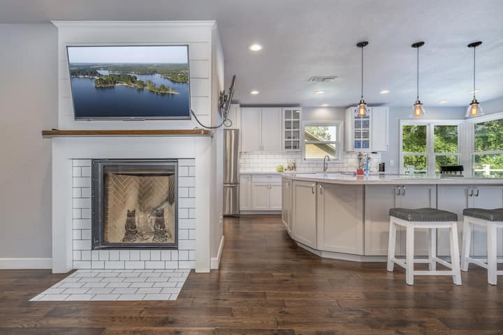 Spend some time relaxing in the living room and not miss any of the action. A very cozy lake house design that promotes family and friends interacting during their stay.