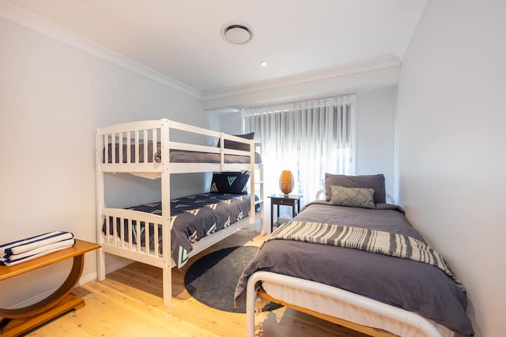 Third bedroom - 3 x single beds with built in wardrobe. Air-conditioning in each room.  Linen Is provided and professionally laundered.