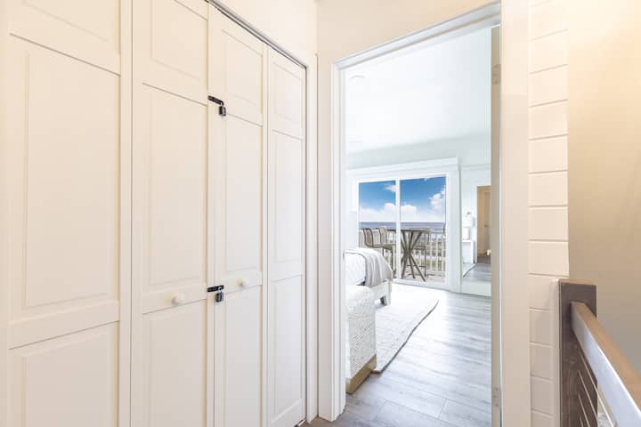 Hallway to the owner's suite. Look at the views with a private deck in the master bedroom.
