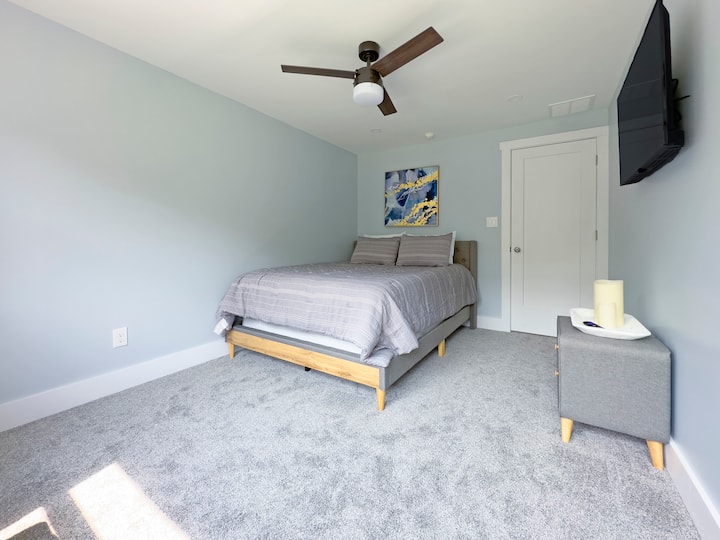 Upstairs Guest Room. Sleeps 2! This beautiful guest room includes a flat screen 38"inch TV ready for streaming, as well as a Queen sized bed and closet for storage!