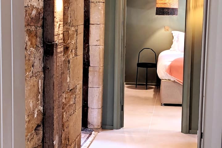Through to the second bedroom, past feature wall and old timbers