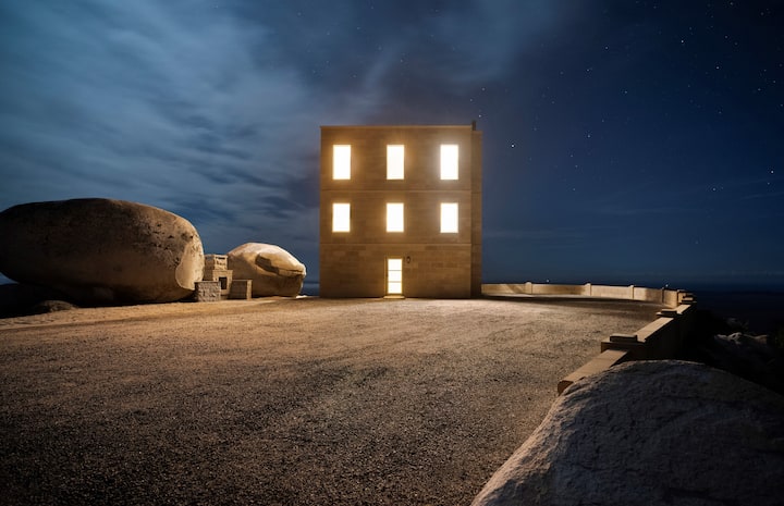 Behold the timeless beauty of The Keep, radiating warmth and grandeur as the night envelops its enchanting façade