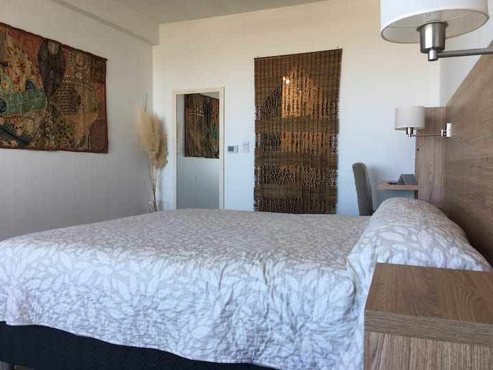 The bedroom connects to the dressing room and front bathroom.