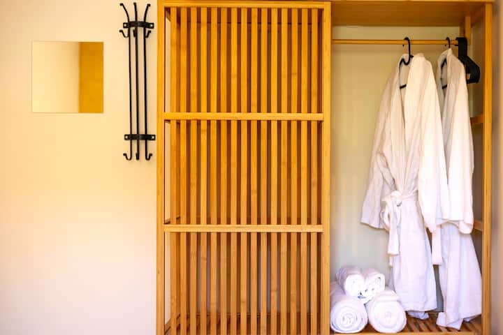 There are body towels, face towels, and two robes in each room.