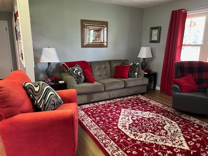 Main floor living room with 50" TV featuring Dish Network.