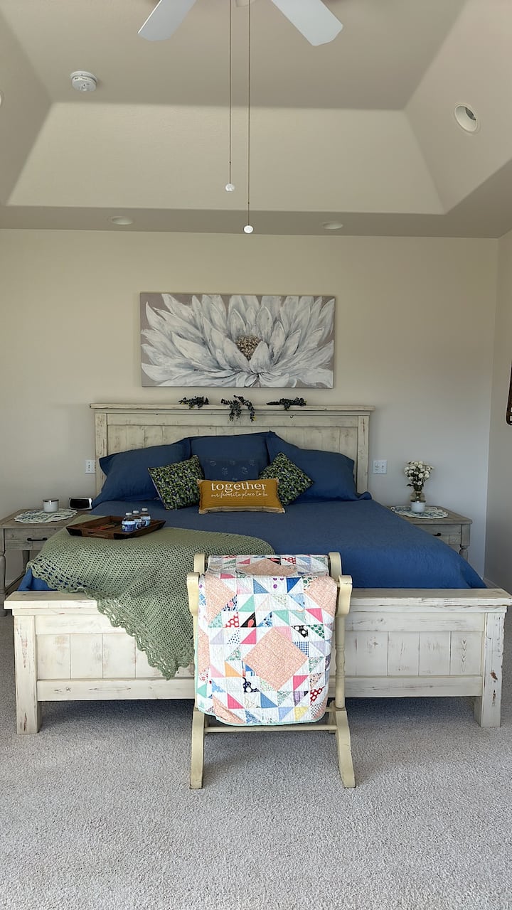 King bed in Blueberry Master Suite includes EnSuite spa bath tub & shower and huge walk-in closet. 

2 Luggage Racks & Laundry baskets, Iron & Ironing board located in master closet.

Master suite hosts a Settee & Rocking chairs to watch birds!