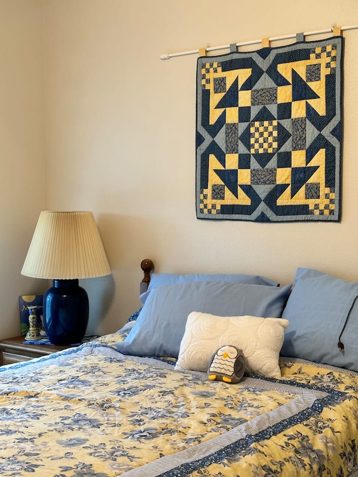 Alaskan Forget-Me-Not Queen Room with view.  This room also has a chair, small table and luggage rack in closet.  All closets have lighting.