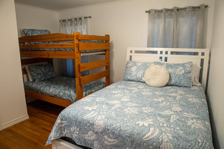Queen bed and bunk beds. 