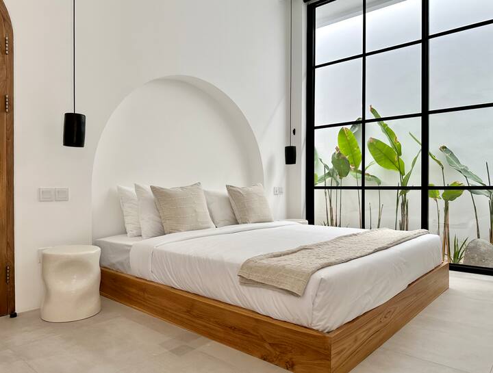 Crafted for couples seeking quiet luxury, the villa offers a king-size bed, closet space, and a private ensuite bathroom, wrapped in privacy, elegance, and a seamless connection between indoor comfort and outdoor serenity.
