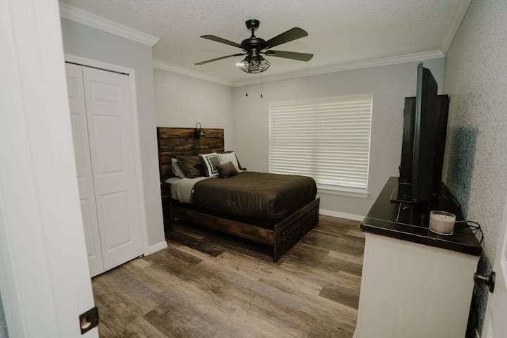 Bedroom 2 has a queen bed and private bathroom.