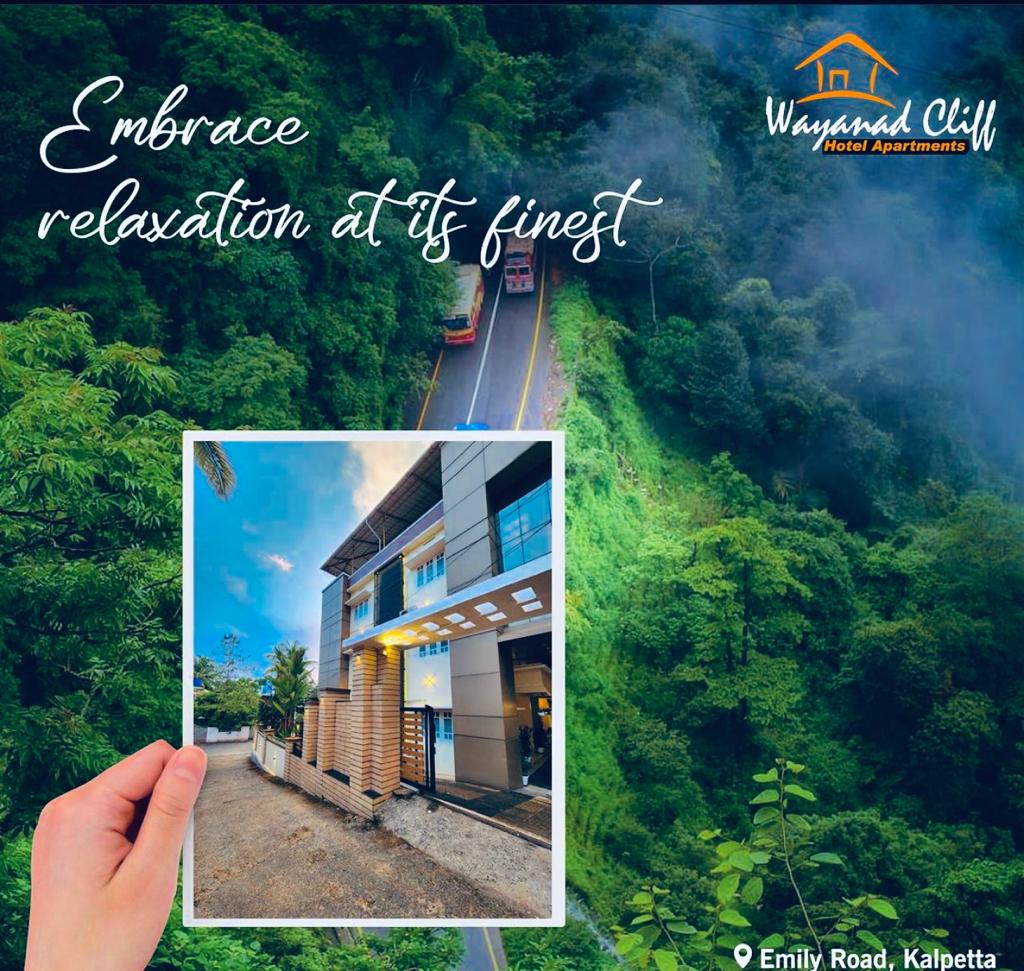 A modern building is depicted against a backdrop of lush greenery, with a well-maintained entrance leading towards a spacious outdoor area. The image highlights the proximity to a winding road, suggesting easy access to the surroundings.