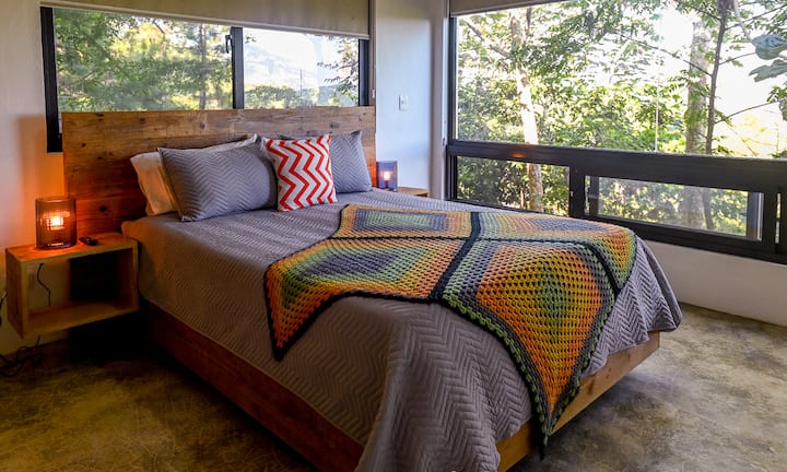 The guest room feels like you are sleeping in a tree house.  The space includes a queen size bed, built in closet with dresser and a smart tv.