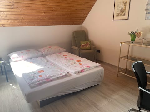 Sparling room with sloping ceilings