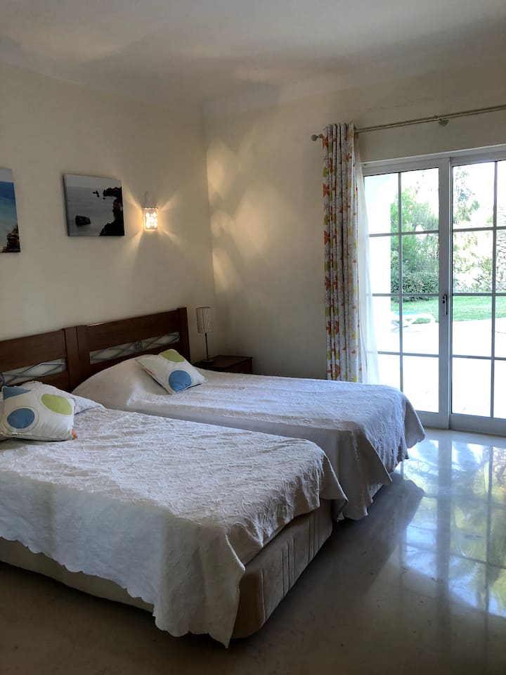 All 4 downstairs bedrooms south facing with patio doors opening to pool.
Upstairs bedroom south facing. Patio doors open to private patio.