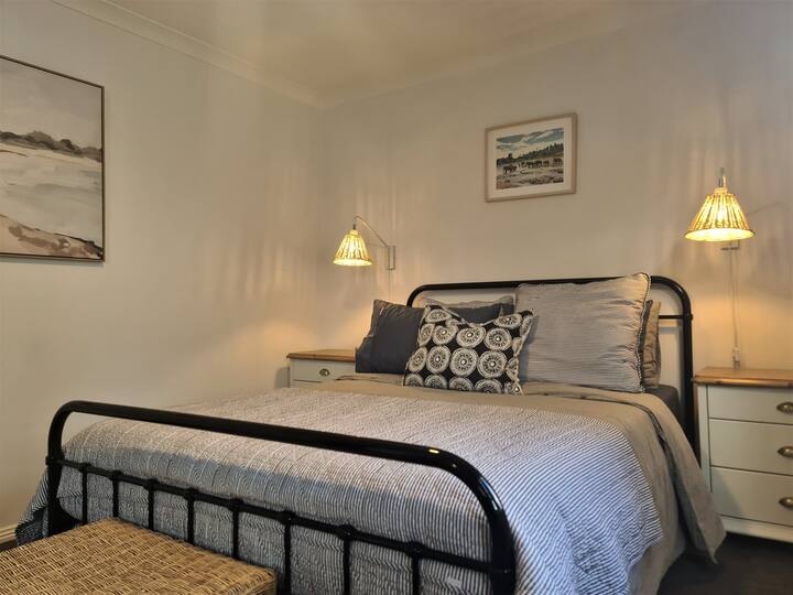 A cosy bedroom with high quality 'Canningvale' linen, 'Emma' eco foam mattress and  blackout blinds and curtains for a restful sleep.