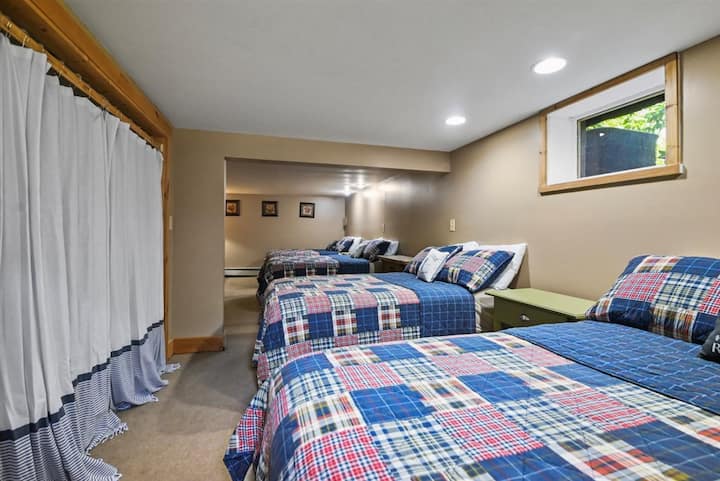 Downstairs bedroom with four full beds