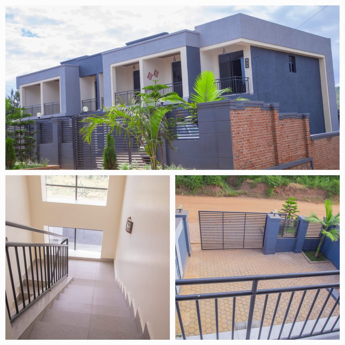 The exterior of the chic, spacious building features a modern design with a blend of gray and brick elements. Lush greenery surrounds the property, enhancing the setting. An interior staircase, illuminated by natural light from a large window, leads to upper levels. A security gate and driveway are visible, providing access.