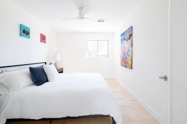 Bedroom #4. Features a king size bed with a luxe mattress, pillows, & linens.
