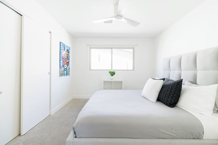 Bedroom #3. Features a king size bed with a luxe mattress, pillows, & linens.
