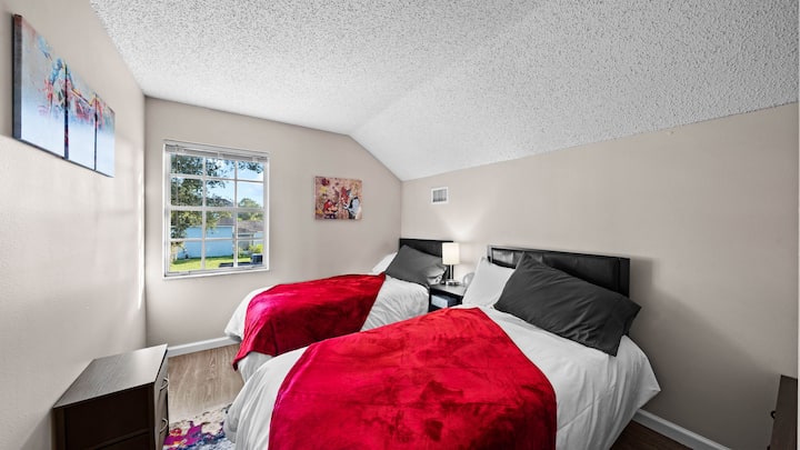 Fun and playful, this room is designed with gamers in mind, offering a lively space to rest and play.