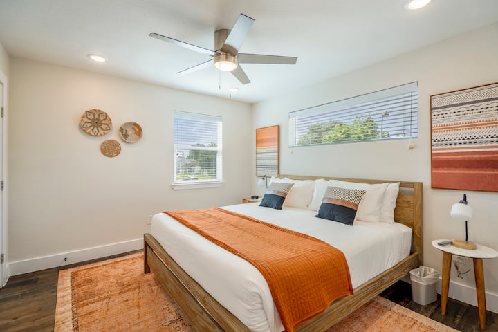 Upstairs Bedroom with King Bed boasts a modern cultural design that contains a personal television, walk-in closet, and 2 door entrance semi-private ensuite bathroom. Daybed occupants may choose to share the bathroom with this bedroom. 