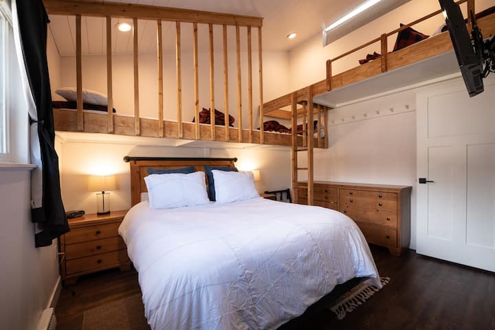 The second bedroom is the show stopper.  A very comfortable queen bed and an incredible loft that was built by the orginial owners.  Their craftsmanship is incredible.  
Kids can choose from 1 of the 3 twin beds in the loft area.  
