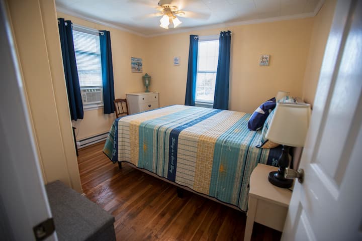 Queen size bed with nightstands that have touch lamps with usb connections. Dresser , closet and make up area.