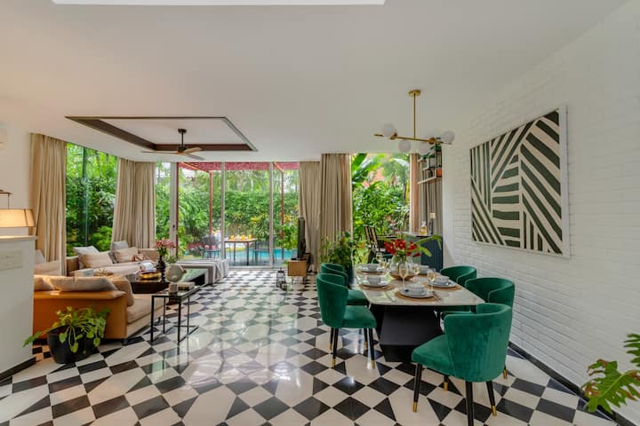 Living Area Adorning Floor to Ceiling French Windows!