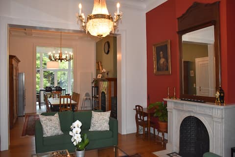 Large mansion with veranda and garden