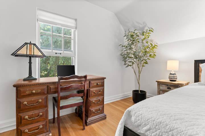 "The Biggy". We love the antique Tiffany lamp on the writing desk. And my favorite views from that window overlooking our park-like front yard.