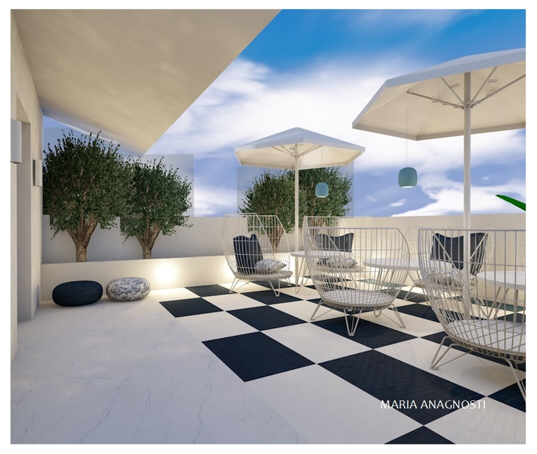 A rooftop terrace is displayed with a distinct checkered floor pattern. Several lounge chairs, equipped with umbrellas, are arranged alongside two small trees and decorative cushions. The open space is illuminated by natural light, creating a serene atmosphere.