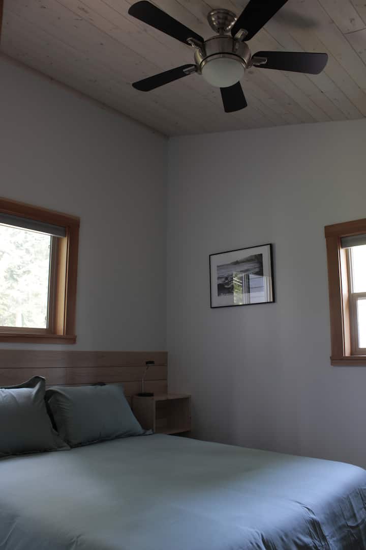 Back bedroom has a ceiling fan, for keeping cool. Both bedrooms have new Juno mattresses. Super comfy.