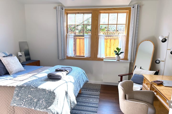 Primary bedroom with east-facing window gets lovely morning light
