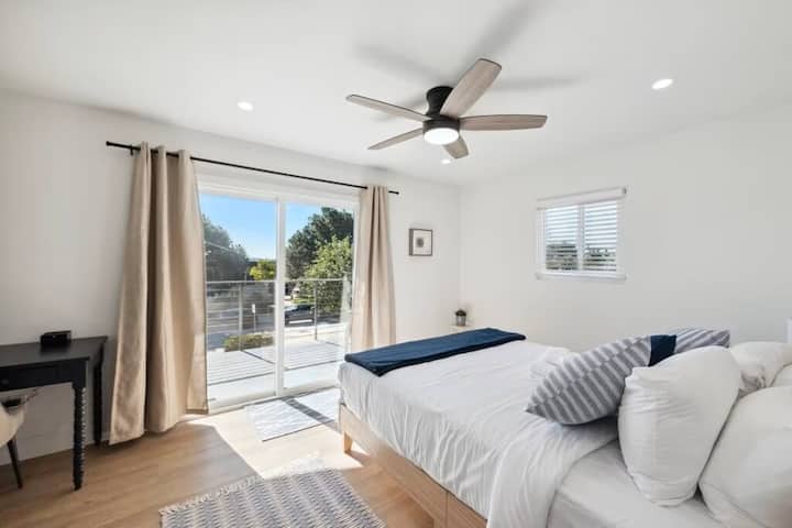 Bedroom 1 - Queen bed, desk, and balcony, upstairs