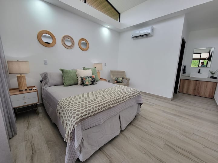 Bedroom 2: Queen bed, A/C unit, private bathroom and smart TV