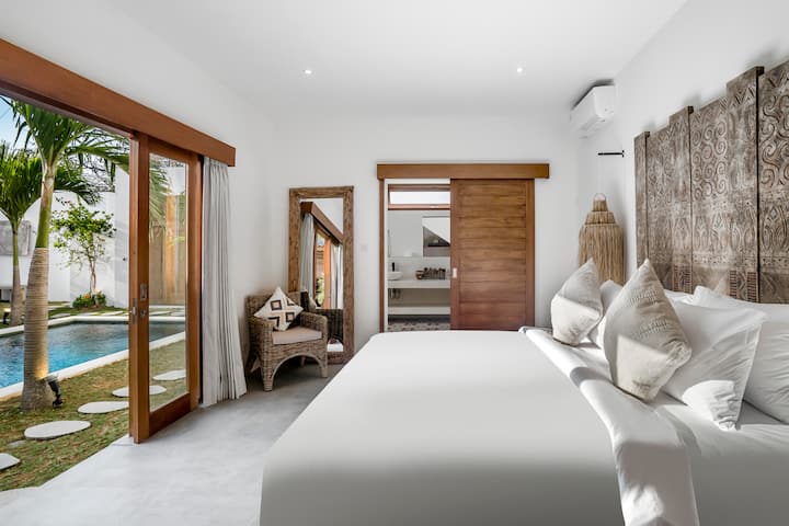 Waking up to a serene pool view – where every morning feels like a vacation in your own bedroom paradise.