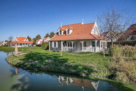 Villa in beach style with small river