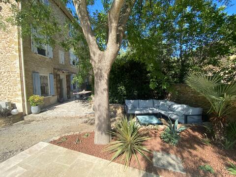 Part of stone farmhouse with swimming pool