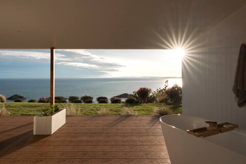 Luxury retreat with outdoor bath and ocean views