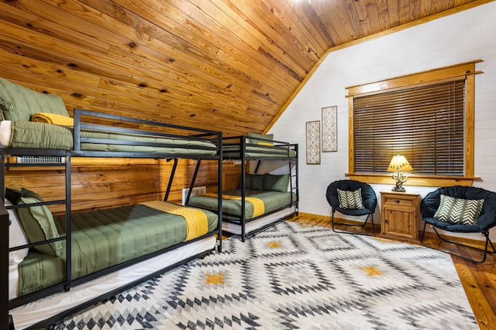 This bunkhouse space sleeps 8! Two twin bunks on top, 2 full sized beds below (each full can sleep 2 people), and 2 twin trundle beds can be pulled out as needed. Extra bedding provided in the large closet. Extra thick padded rug for comfort.