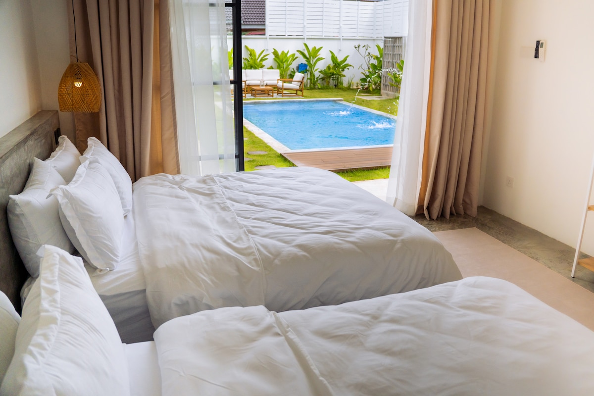 View from Bedroom 2 featuring 2 queen beds for 4 guests