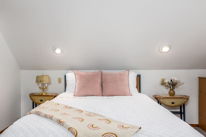 Queen size bed in the top bedroom.