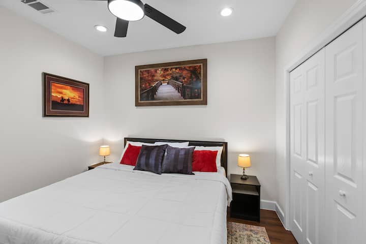 Second king bedroom with memory-foam mattress, bedside lighting, and generous closet storage — perfect for couples or traveling colleague.