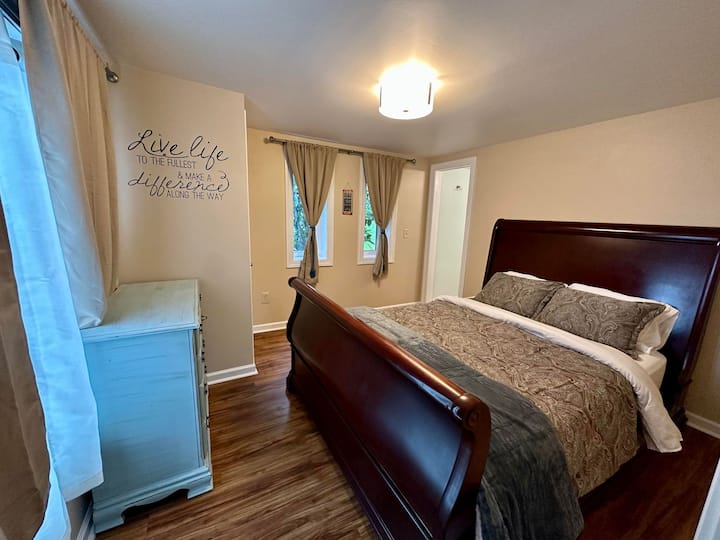 The private queen bedroom off the open king bedroom on the lower floor downstairs. There is a private bathroom here as well. 