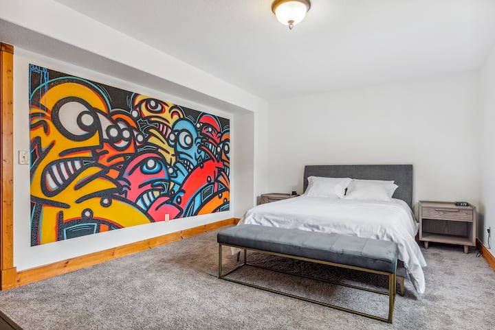 The basement bedroom features murals by Italian Artist, Galo. 
